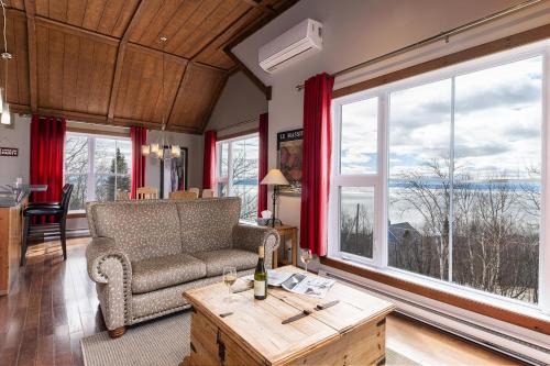 Petite-Riviere-Saint-Francois Apartment | Condo 120H, Riverfront Views, Terrace & BBQ