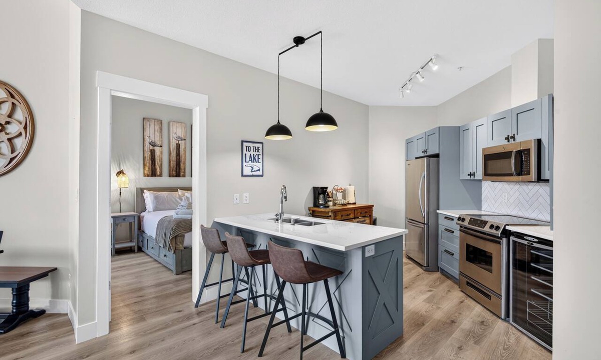 Westbank Apartment | Escape to The Cove Lakeside Resort in this beautifully renovated ground-floor 2-bed, 2-bath condo. Features a huge walk-out patio with a private gate, cozy outdoor seating, and direct access to the pool, beach, marina, and waterfront trails.