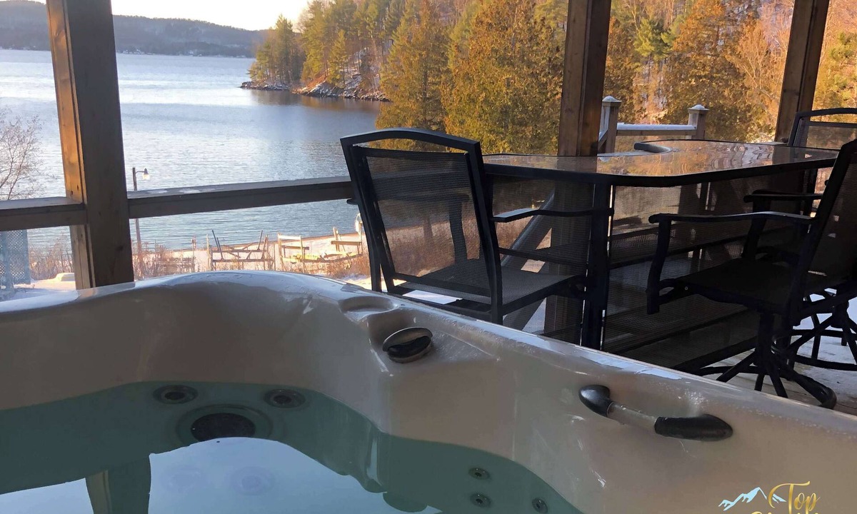 Cheneville Ski Chalet | Front LAKE Simon, HOT TUB, private BEACH, 4 bedroom, 2 private office, 10 beds, 16 people.