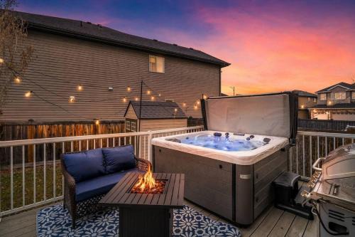 Northwest Edmonton Apartment | Game Night Getaway - HotTub - AC - BBQ - Firetable - KingBed