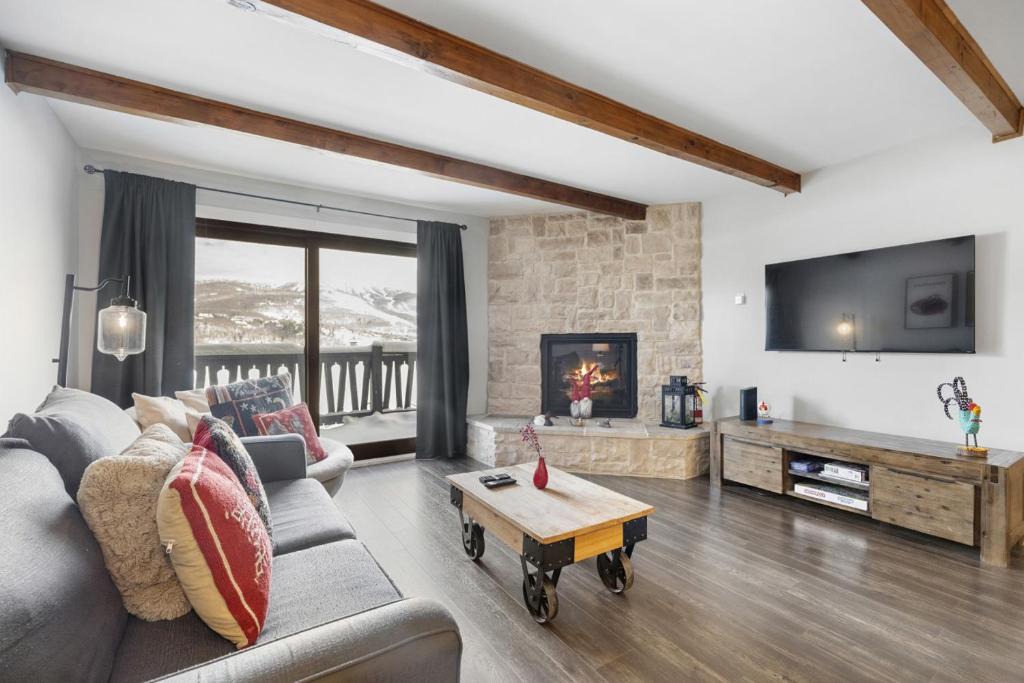 Mont-Tremblant House | Luxury Condominium with Rustic Minimalist Style