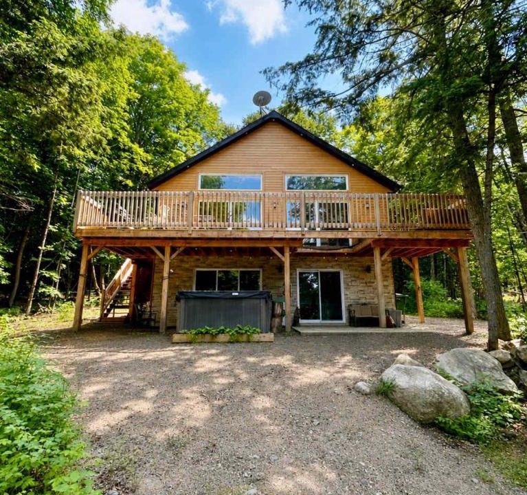 Amherst House | Modern Retreat in Forest with Hot Tub