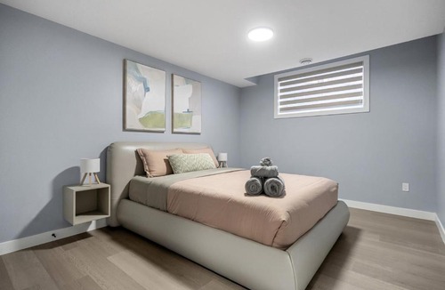 Airdrie Apartment | 1BR Entertainment Space Projector and Games Room