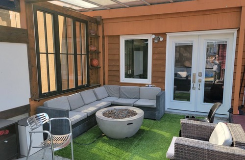 Burnaby House | 8 minute walk to skytrain Central Great covered outdoor seating with fire table.
