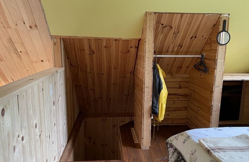Notre-Dame-Des-Bois Cabin | A cozy rustic mountain side cabin with a small river on the property.