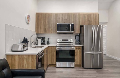 Northwest Calgary House | Arcade, Great Coffee, 80 min Banff, Brand New