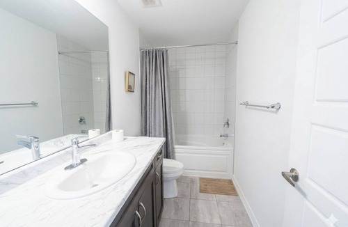 Brampton House | Bedroom (Queen bed) within shared space