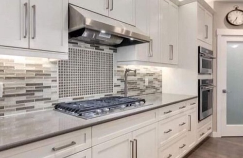 Okotoks House | Bright, spacious family home with great a outdoor space overlooking green space.