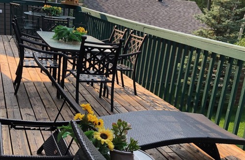 Sunbreaker Cove Cottage | Cedar Log Cottage , nestled in the trees with wrap around deck