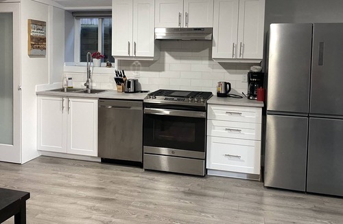 Mission Apartment | Contemporary two bedrooms lower level guest suite with luxury hot tub