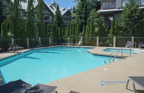 Village North Condo | Cozy Ground Floor, Free Parking, Pool and Hot Tub, Deck