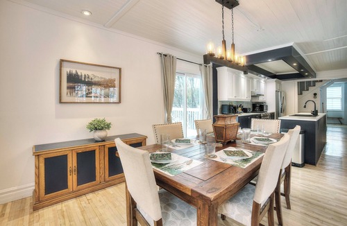 Mont-Tremblant House | Escape to our 100-year-old ancestral home on 23 private acres by Lac Jolicoeur. This lakefront retreat is perfect for large groups of up to 15, offering year-round magic with a private hot tub, stone fireplace, and game room.