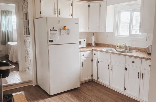 Ruthven Cottage | Escape to Paradise on 5th in Kingsville — a cozy bungalow cottage.