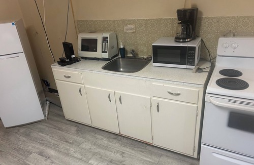 Merritt Hotel | Kitchenette with in room modem hardwired internet.