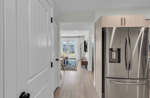 Calgary Apartment | Luxury Suite: King Bed, Workspace, Huge Lawn & Epic Sunset