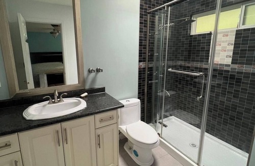 Richmond House | Master bedroom, with king bed, walk in closet, ensuite bath, microwave & fridge