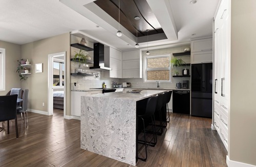 Regina House | Modern Family Retreat with 3 Season Sunroom