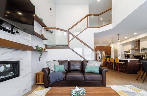 West Edmonton House | Nordic Retreat near WEM | Hot Tub, 2 Lounges, Fire Table, King Suite Sleeps 10