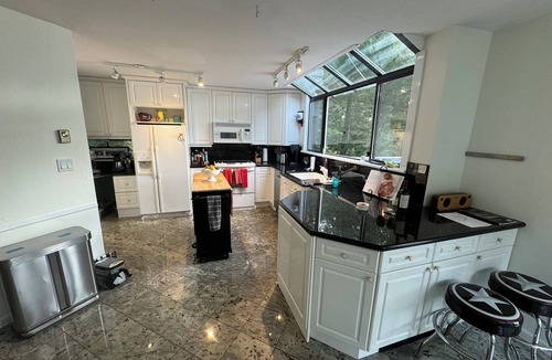 Garden Bay House | Oceanfront property in Pender Harbour with a dock, wrap around balcony with view