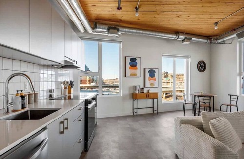East Village Apartment | Private Hot Tub, River Views, Walk to Stampede