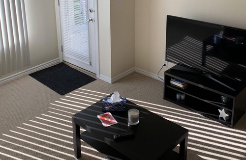 Panorama Hills House | Private suit In a pleasant garden setting, a king bed