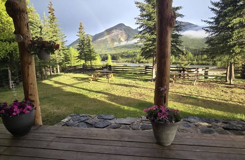 Buckinghorse River Cabin | Room 6 at the Main Lodge with a queen bed and single bed.