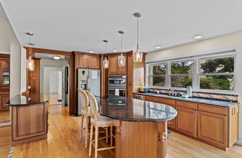 Sea Trail House | Shining Waters: Gorgeous waterfront home with private hot tub, pool, views, deck, & fireplace