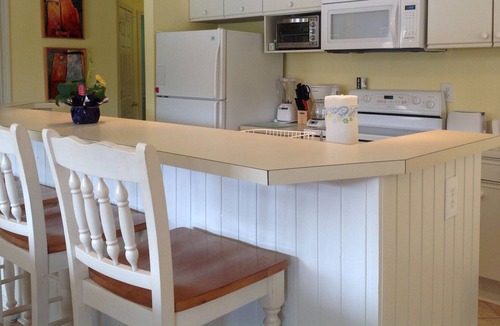 Sea Trail Condo | Spacious, First Floor Corner Unit, brings outdoors in w/ magnificent pond view!