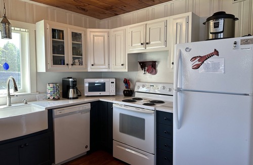 Mid-Coast and Islands Cottage | Step off the deck to enjoy the beach & a short walk down the scenic peninsula ~