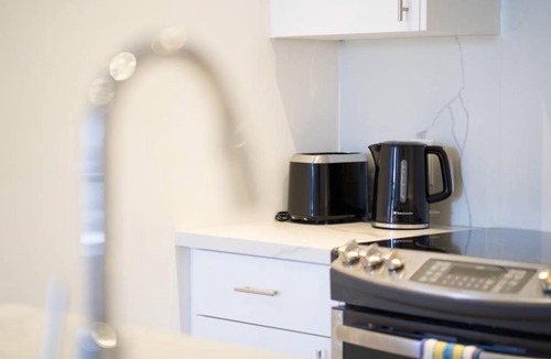Beaconsfield Village Apartment | Stylish Home in Queen West