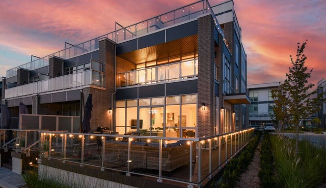 5BR townhouse with private dock, patios, and stunning views.