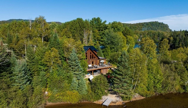 At the edge of a navigable lake offering dazzling sunsets.
