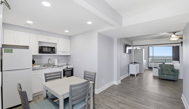 Beachfront Studio | Kitchen + Pool & Picnic Area