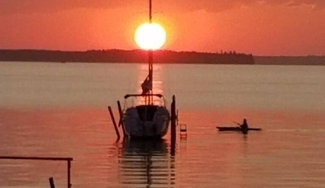 Beautiful Sylvan Lake waterfront property with unobstructed beach access.