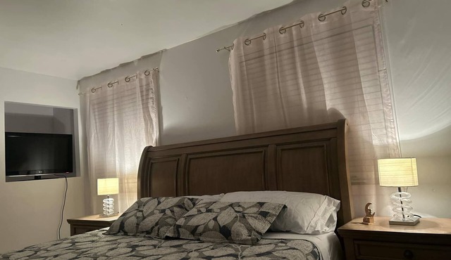Charming bungalow with AC and WiFi in serene Blainville 1 King size bedroom