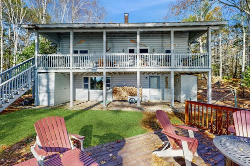 Charming riverfront home with cozy interiors, dock, and scenic deck views