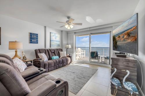 Direct oceanfront 2/2 condo with large private balcony, heated pool, and garage parking