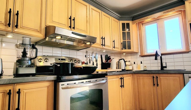 "Discover Stunning Views & Relaxation at Au Chant de la Rivière, Gaspésie"