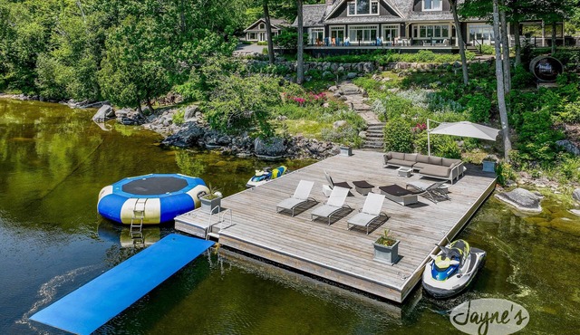 Exquisite 5 Bdrm 4 Bath Cottage with Boathouse and Professional Gym! SW Views!