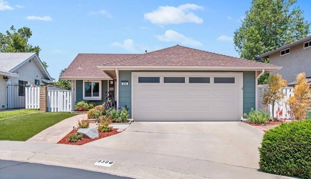 Golf course views abound in this picturesque Shadowridge Cottages home,