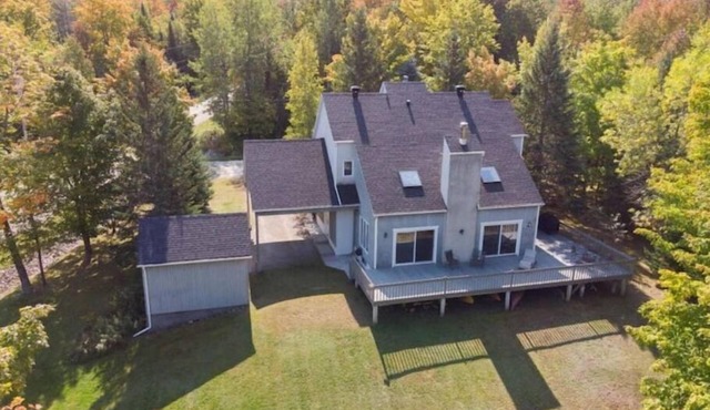 Lake Stuckley country home nestled into Mont Orford