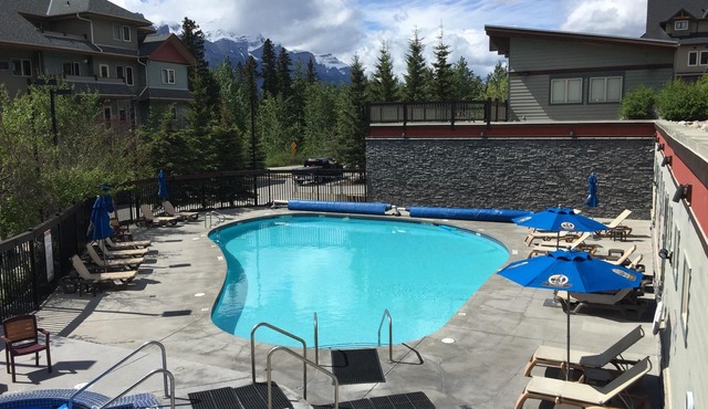 Modern, rustic mountain view loft style condo with pool, hot tubs & XL beds.