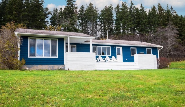 Modern style home with spectacular views of the Margaree River.