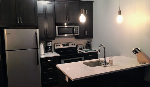 Spacious Mountain View Condo Heated Pool & BBQ - Ski, Golf, Cycling, Water Park